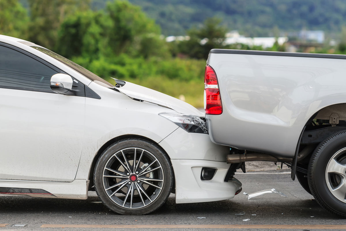 A rear-end collision involving a car and a pickup truck.